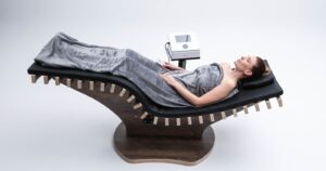 This picture shows a woman lying on the Wellness Lounger Spa 